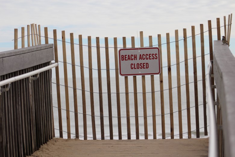 A fence blocks a beach dune crossover in Bethany Beach in late September 2026 with a sign that reads Beach Access Closed.
