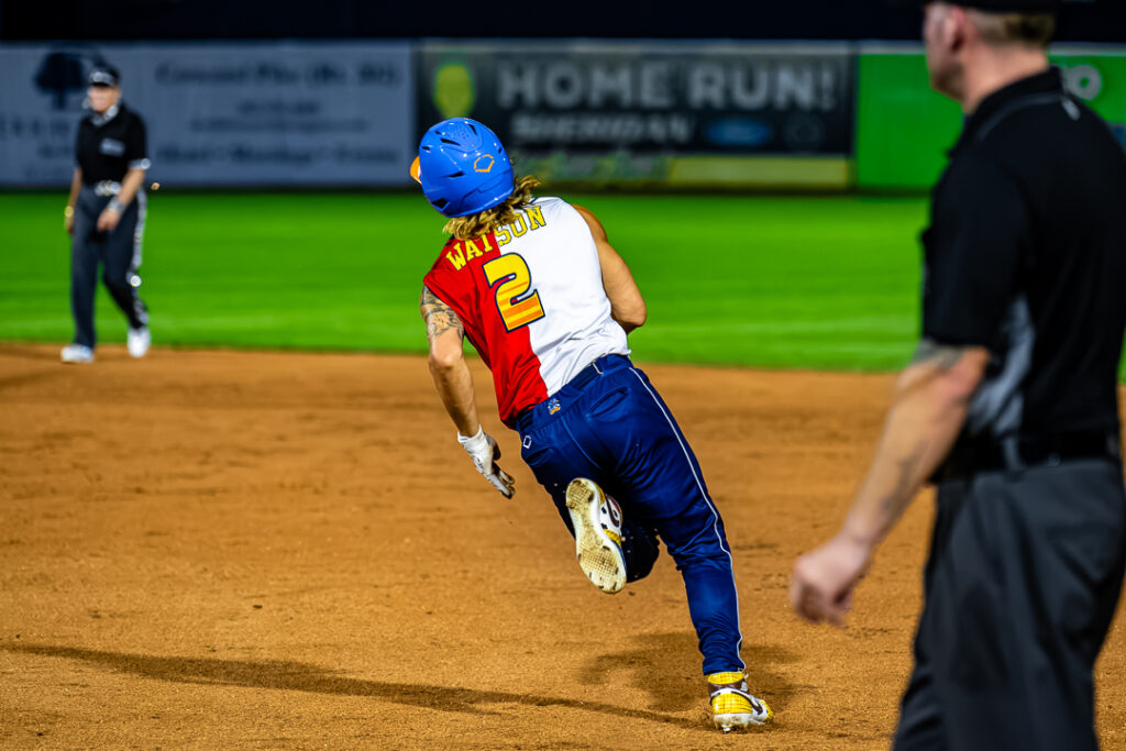 Zach Watson turns toward second base after getting a hit against the Coconut pitcher. Photo Credit: Dave Reeder